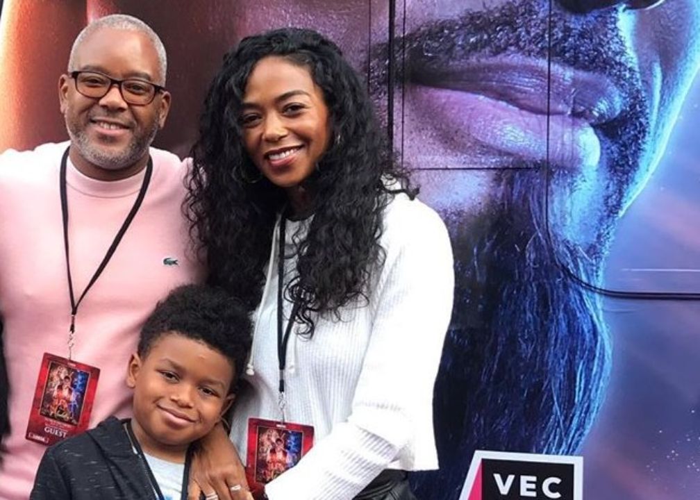 Ananda Lewis with her husband, Harry Smith, and their son, Langston.